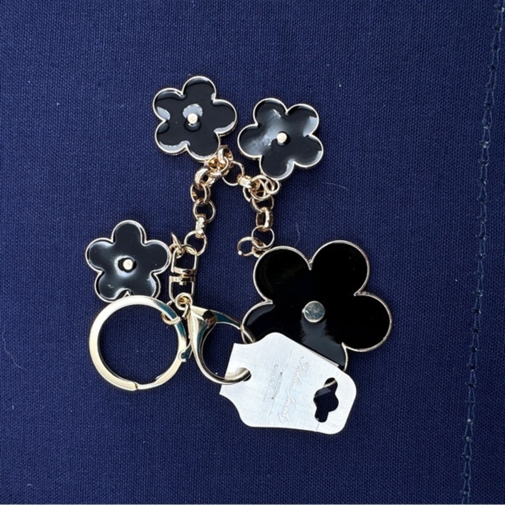 Unbranded keychain or purse charm. White and black.